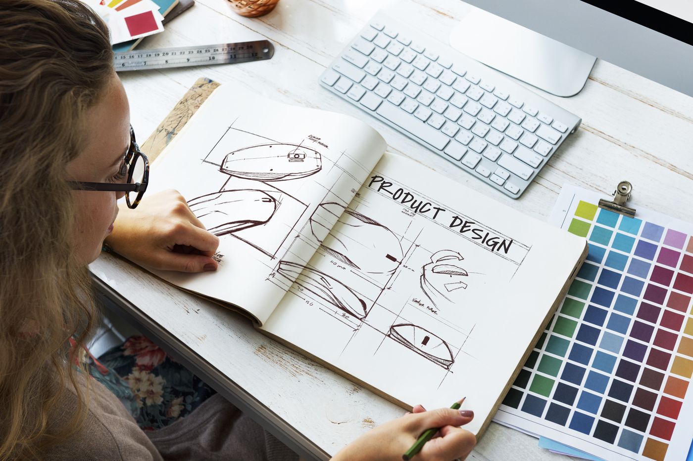 Designer sketching ideas with a colour palette